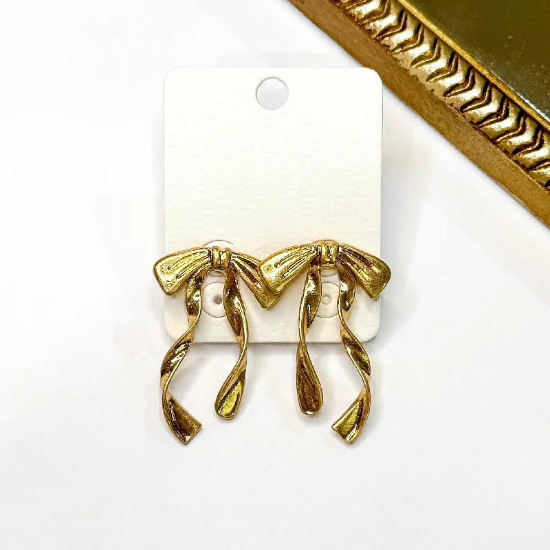 Designer Earrings for Special Occasions-Ribbons and Bows Gold Tone Earrings